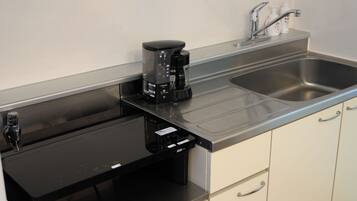 Full-size fridge, microwave, stovetop, electric kettle