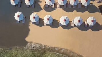 On the beach, beach cabanas, sun loungers, beach umbrellas