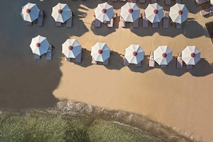 On the beach, beach cabanas, sun loungers, beach umbrellas