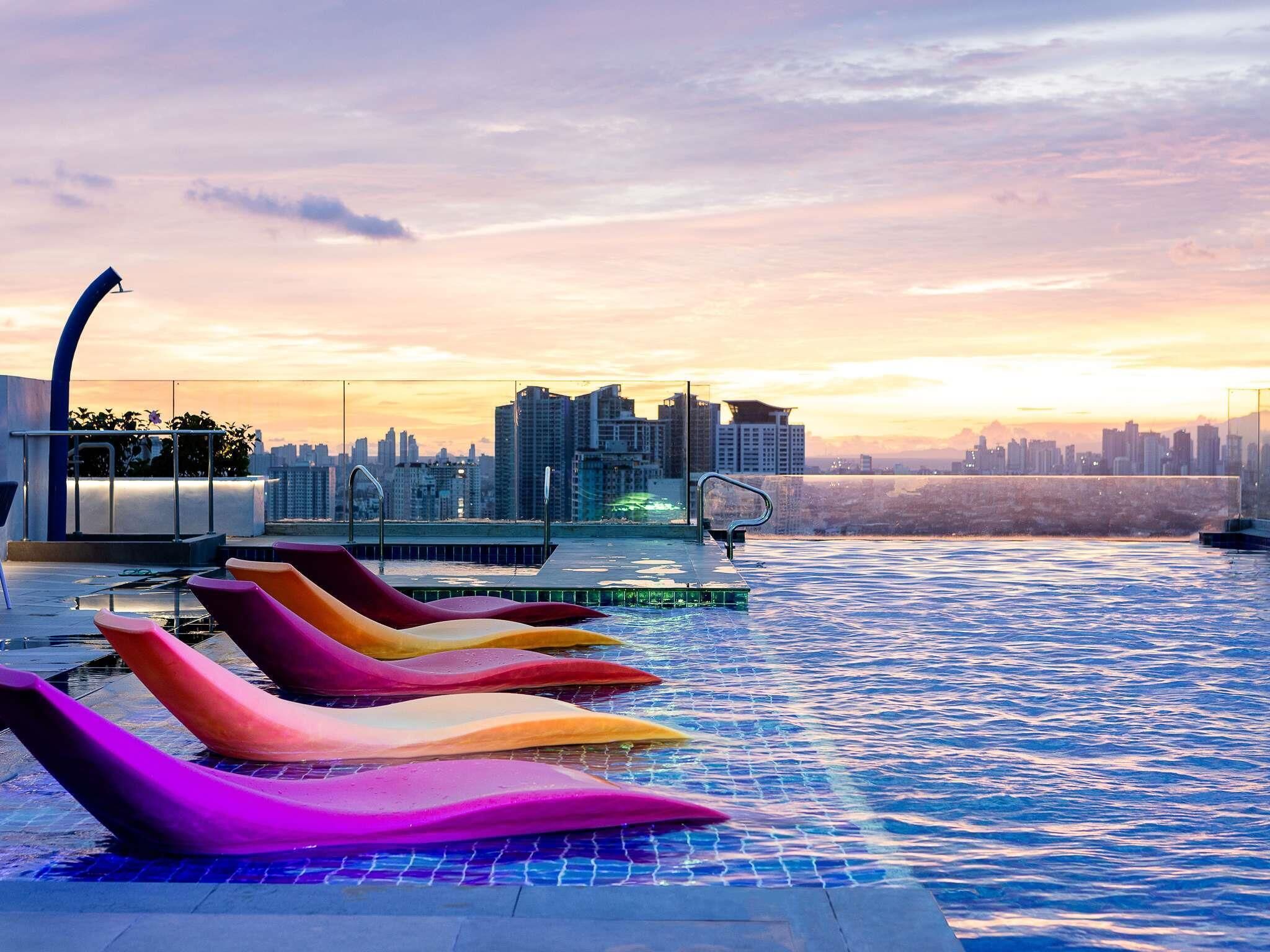 2 outdoor pools, open 8:00 AM to 7:00 PM, pool umbrellas