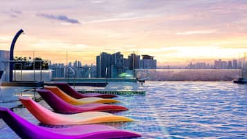 2 outdoor pools, open 8:00 AM to 7:00 PM, pool umbrellas