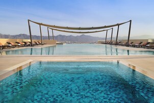 Outdoor pool, pool umbrellas, sun loungers
