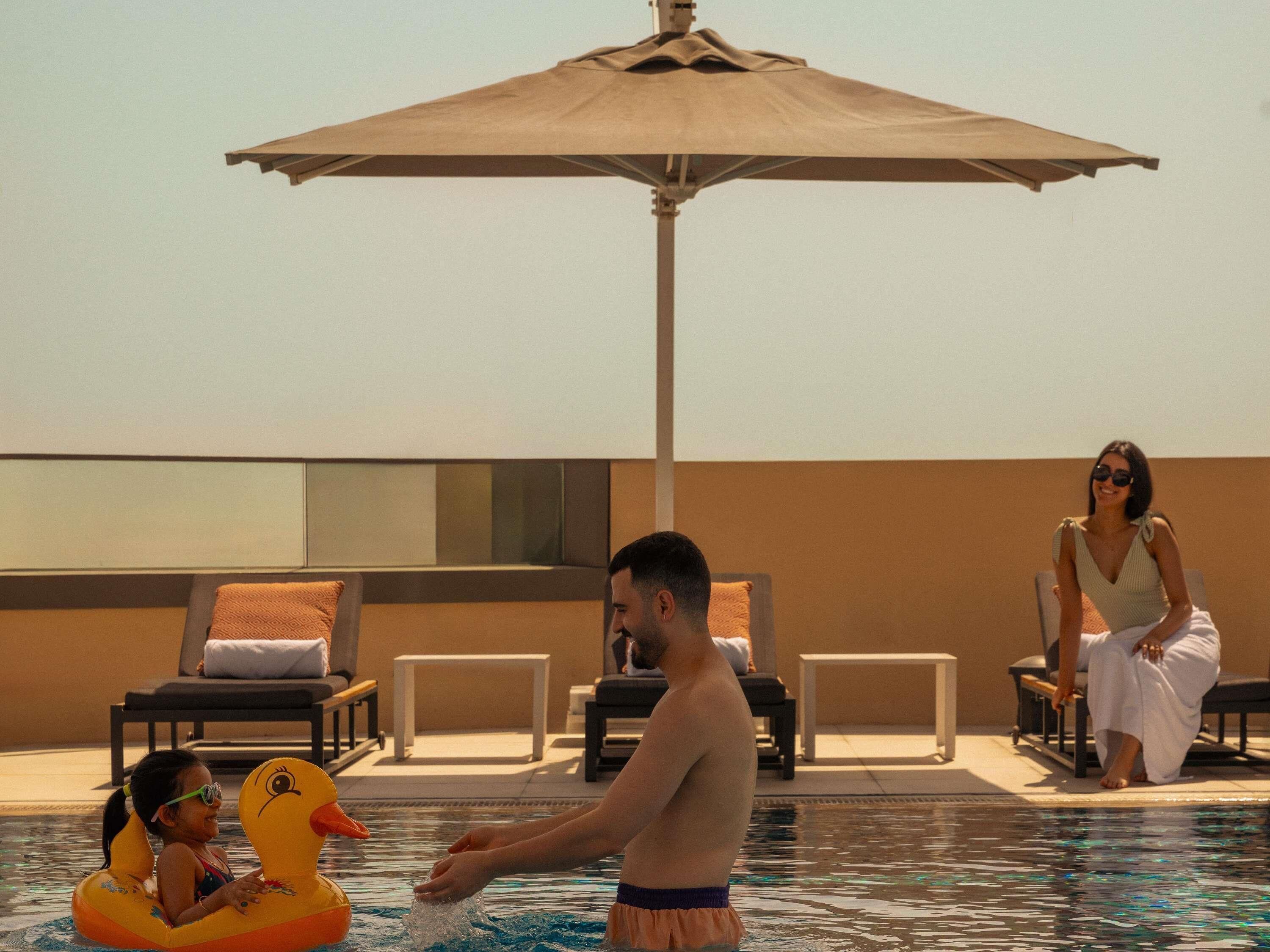 Outdoor pool, pool umbrellas, sun loungers