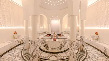 Symmetrical design with a central fountain, checkered floor, and intricate geometric patterns.
