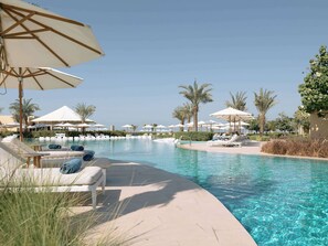 4 outdoor pools, open 6:00 AM to 6:00 PM, pool cabanas (surcharge)