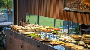 A buffet setup with various dishes and utensils. - Monalisa Hotels Çanakkale (Çanakkale)