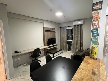 Business Apartment | Living area | 40-inch Smart TV with cable channels