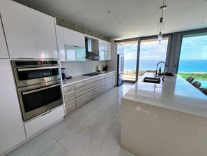 Fridge, microwave, oven, stovetop - Torremar Luxury Villa: A Luxurious Coastal Escape for Adults (Isabela)
