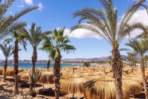 Private beach, beach umbrellas, beach towels, beach bar