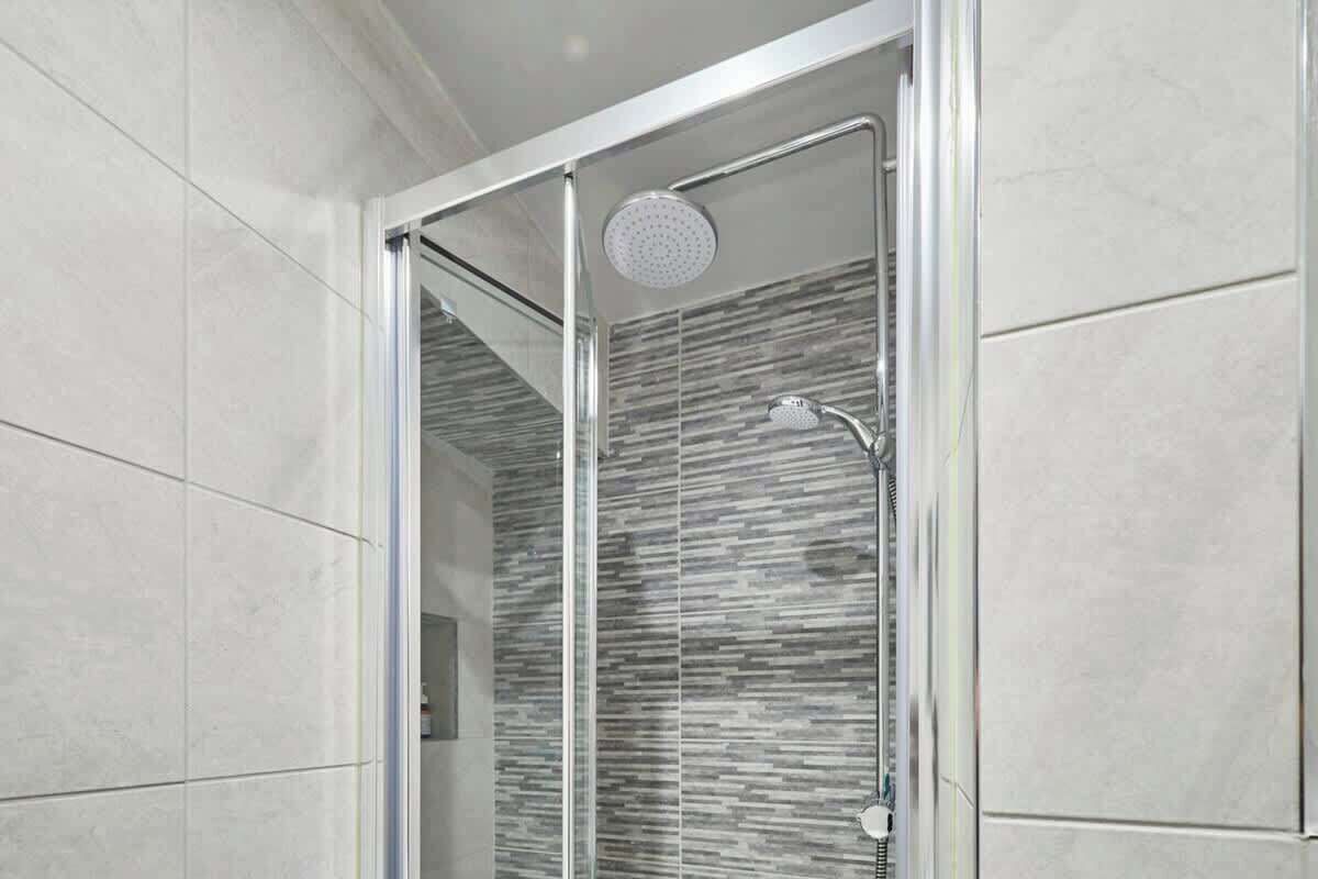 Shower, hair dryer, towels, shampoo
