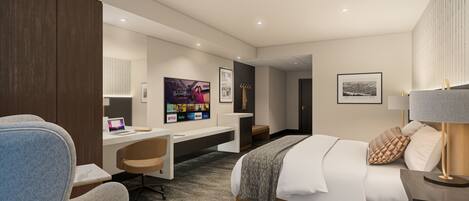 Une chambre d’hôtel moderne équipée d’un lit, d’un bureau, d’une chaise et d’un téléviseur permettant d’accéder à des services de diffusion en continu.
