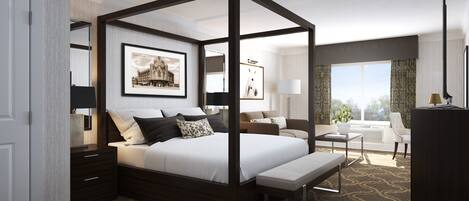 Una habitación de hotel moderna con cama con dosel, una zona de estar con sofá y sillones, un escritorio y un ventanal con vistas.