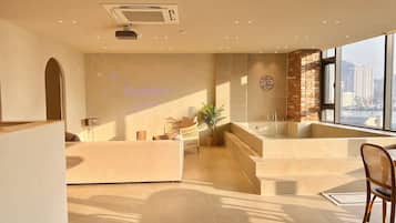 Signature Villa | Living area | 110-inch Smart TV with digital channels, Netflix, heated floors