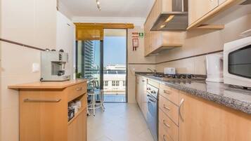 Fridge, coffee/tea maker, cookware/dishes/utensils