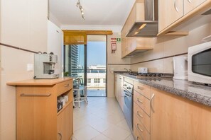 Fridge, coffee/tea maker, cookware/dishes/utensils