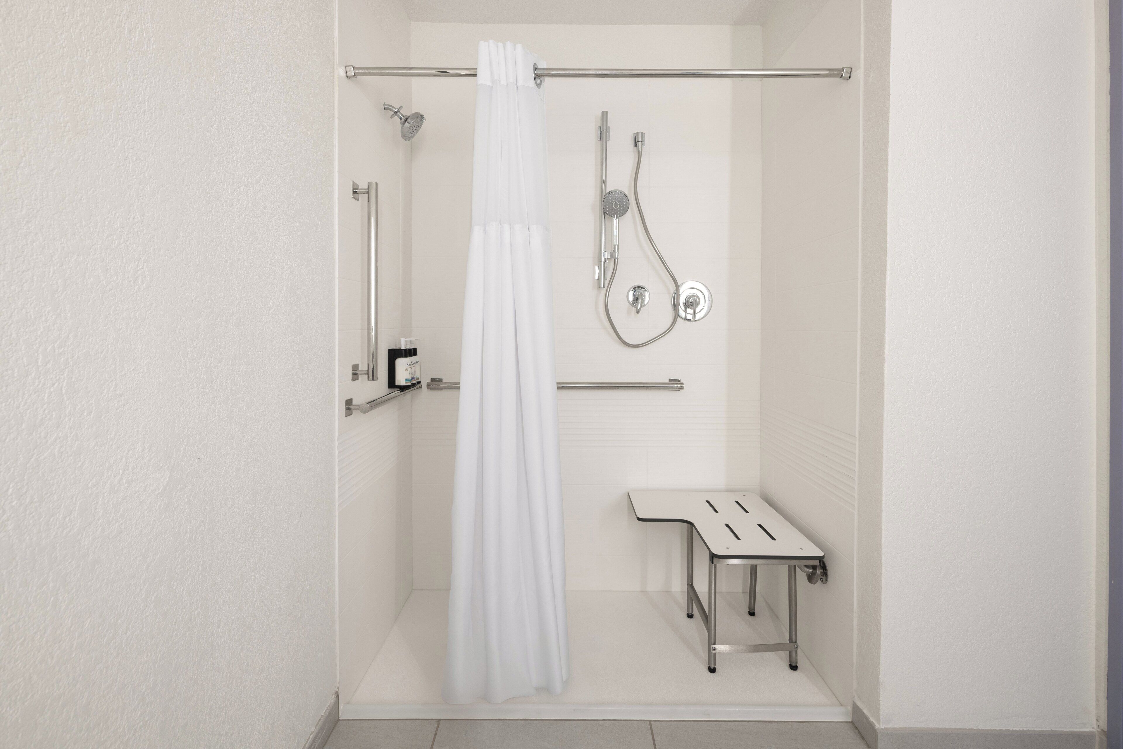 Suite, 1 King Bed, Roll-in Shower (Roll-In Shower) | Pillowtop beds, desk, laptop workspace, blackout drapes