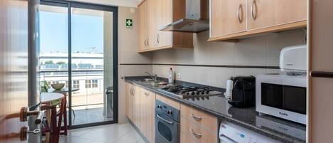 Fridge, coffee/tea maker, cookware/dishes/utensils