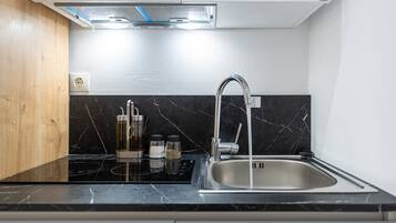 Fridge, coffee/tea maker, electric kettle, cookware/dishes/utensils