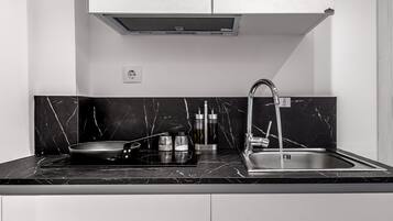 Fridge, coffee/tea maker, electric kettle, cookware/dishes/utensils