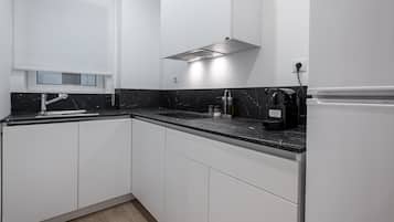 Fridge, coffee/tea maker, electric kettle, cookware/dishes/utensils