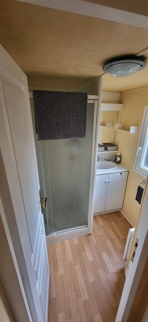 Shower, hair dryer, towels, soap