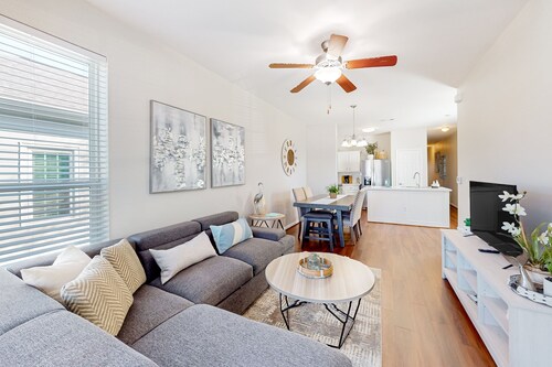 Two-story home blocks from the Seawall with balcony, AC, & W/D