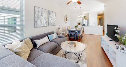 Two-story home blocks from the Seawall with balcony, AC, & W/D