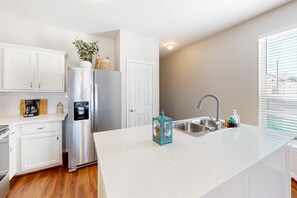 Fridge, microwave, oven, stovetop - Two-story home blocks from the Seawall with balcony, AC, & W/D (Galveston)