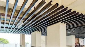 A modern architectural structure with a series of parallel beams and columns, likely part of a building's support system. - OYO Life 93310 Apartemen Tamansari Panoramic By Santuy 2 (Bandung)