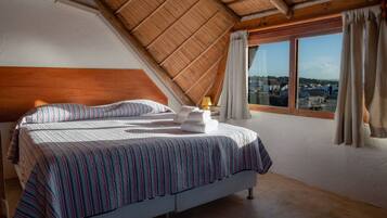 Deluxe Quadruple Room | Minibar, laptop workspace, blackout curtains, free WiFi