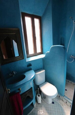 Shower, hair dryer, towels, toilet paper