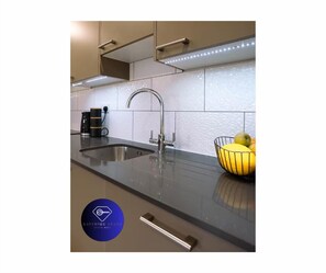 Coffee/tea maker, fridge, microwave, oven