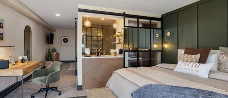 A modern bedroom with a bed, desk, and chair.