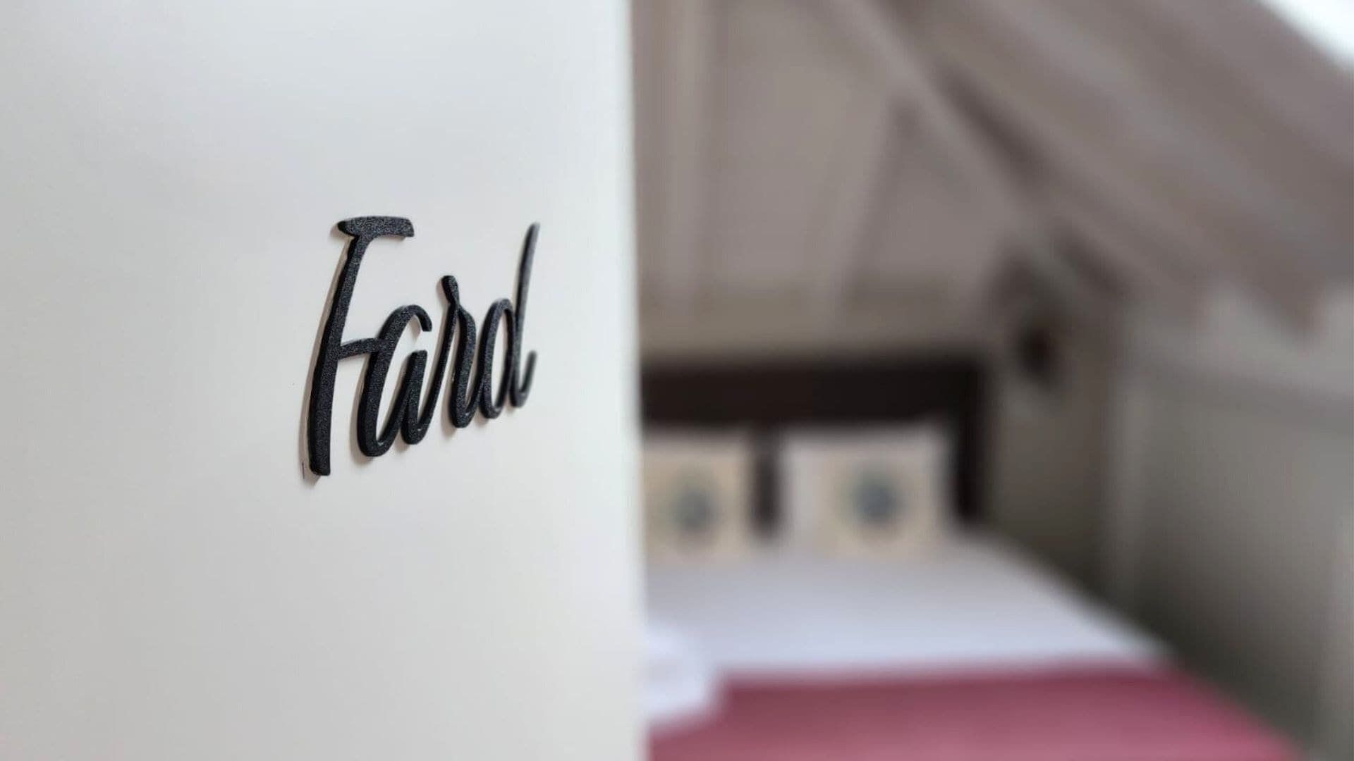A close-up of a wall with the word "Ford" written on it.