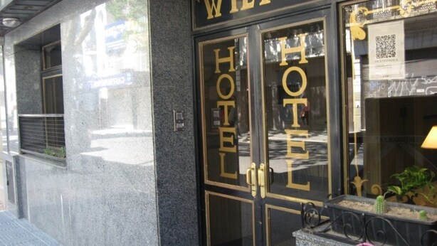 A hotel entrance with a glass door and the words "HOTEL" in gold letters. - Hotel Wilton BA (Buenos Aires)