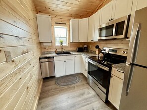 Fridge, microwave, oven, stovetop - Buoy Cottage #8 at Explore Acadia Cottages (Bar Harbor)