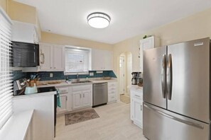 Fridge, microwave, oven, stovetop - Charming Home in Speedway. King Beds. Pet Friendly! (Indianapolis)