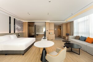 1 King Suite with Daybed | Premium bedding, down comforters, laptop workspace, blackout drapes