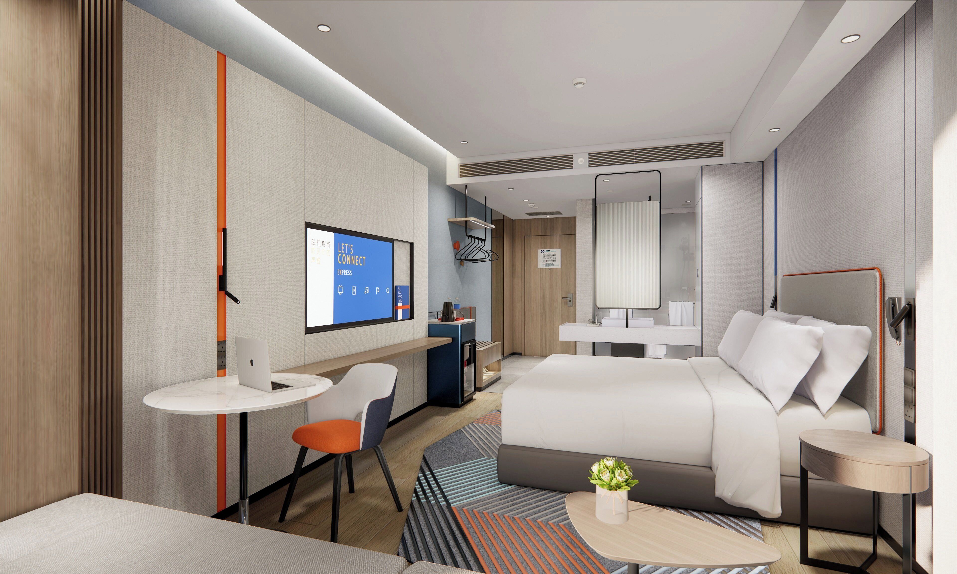 Una habitación de hotel moderna con una cama, un escritorio, una silla, una mesita y un televisor.