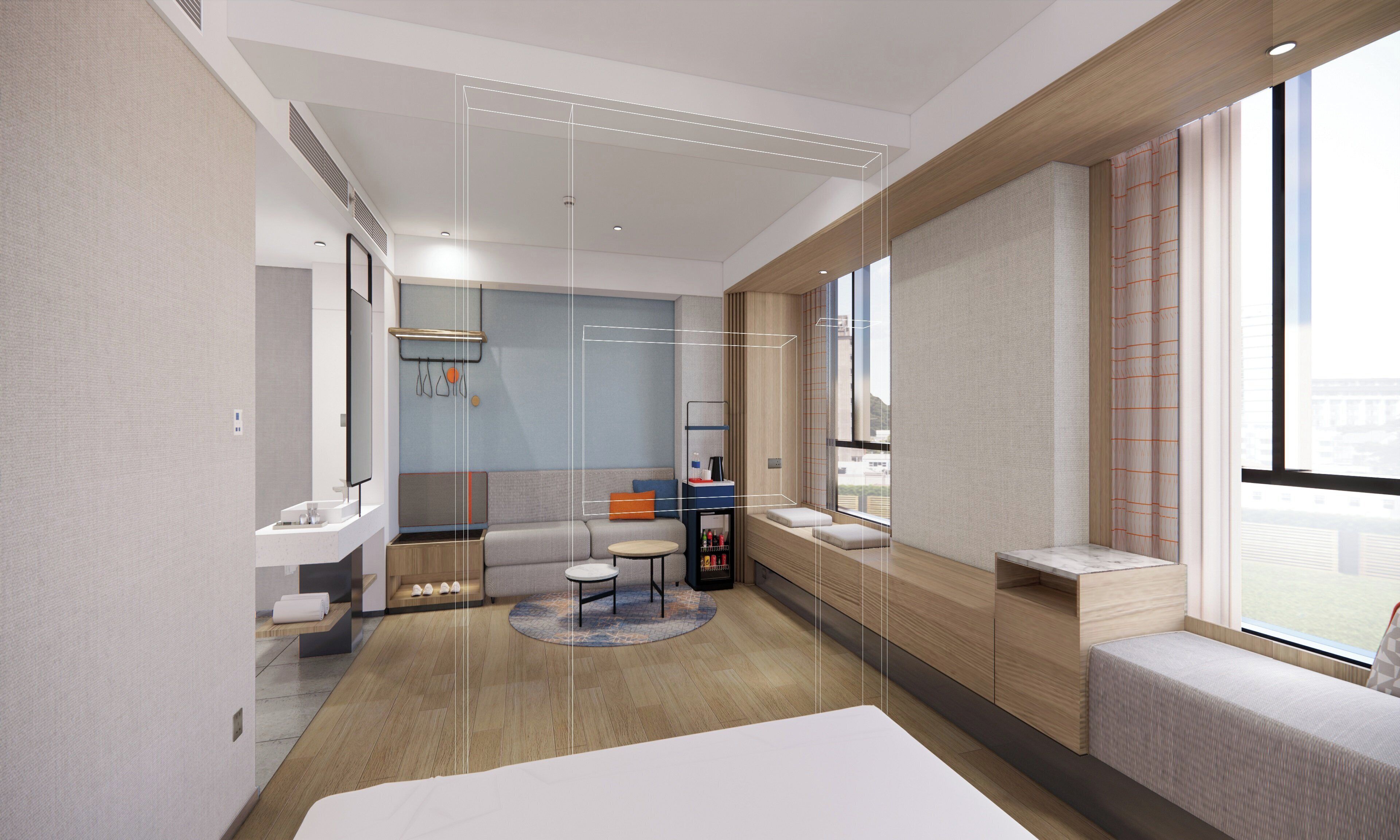 A modern hotel room with a bed, a sofa, a small table, a round rug, a window with a view, and a bathroom with a mirror and sink.