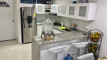 Fridge, stovetop, cookware/dishes/utensils, spices