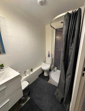 Shower, hair dryer, towels, soap