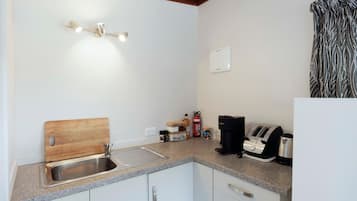 Fridge, microwave, coffee/tea maker, toaster