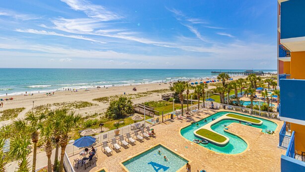 A resort with a pool area, beach access, and a view of the ocean. - Atlantica Resort 2/2 OF Condo with Dishwasher and Washer/Dryer in Myrtle Beach (Myrtle Beach)