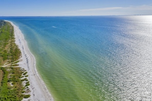 Beach - Nestled along a pristine canal with long range views, this meticulously crafted residence defines coastal luxury at its finest.NEW! (Sanibel)