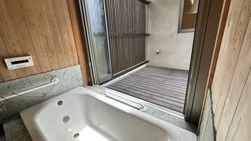 Villa | Bathroom | Combined shower/tub, spring water tub, hair dryer, electronic bidet