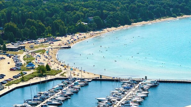 A coastal area with a marina, beach, and surrounding greenery. - "The Lake House" With Spectacular Views!!! Steps to Beach!! (Port Elgin)