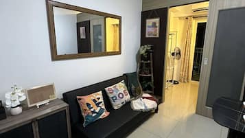Deluxe Condo, 1 Double Bed with Sofa bed | Living area | 32-inch Smart TV with digital channels