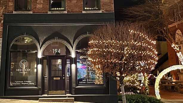 A brick building with a storefront labeled 'Mind Body Spa' and a number '194' above the entrance. - The Top Shelf on the Bourbon Trail in Historical Downtown Versailles (Versailles)