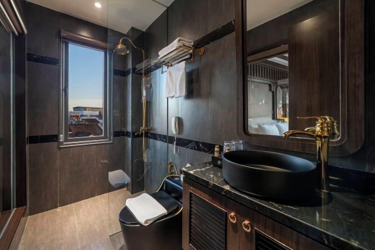 Bathroom | Shower, hydromassage showerhead, designer toiletries, hair dryer